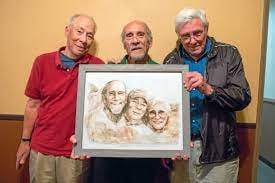 The Ford Street Project founders holding the portrait painting