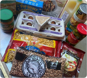 A table with many different foods and snacks.